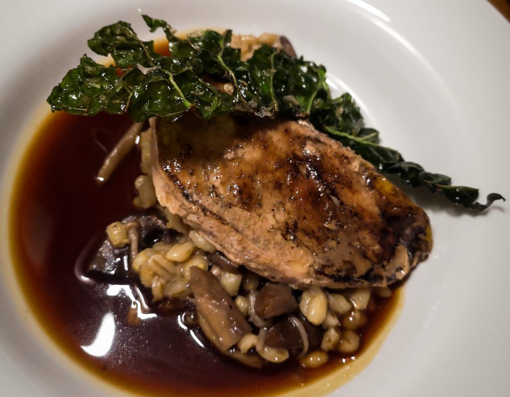 Pheasant dish full of pearl barley, wild mushrooms and crispy kale