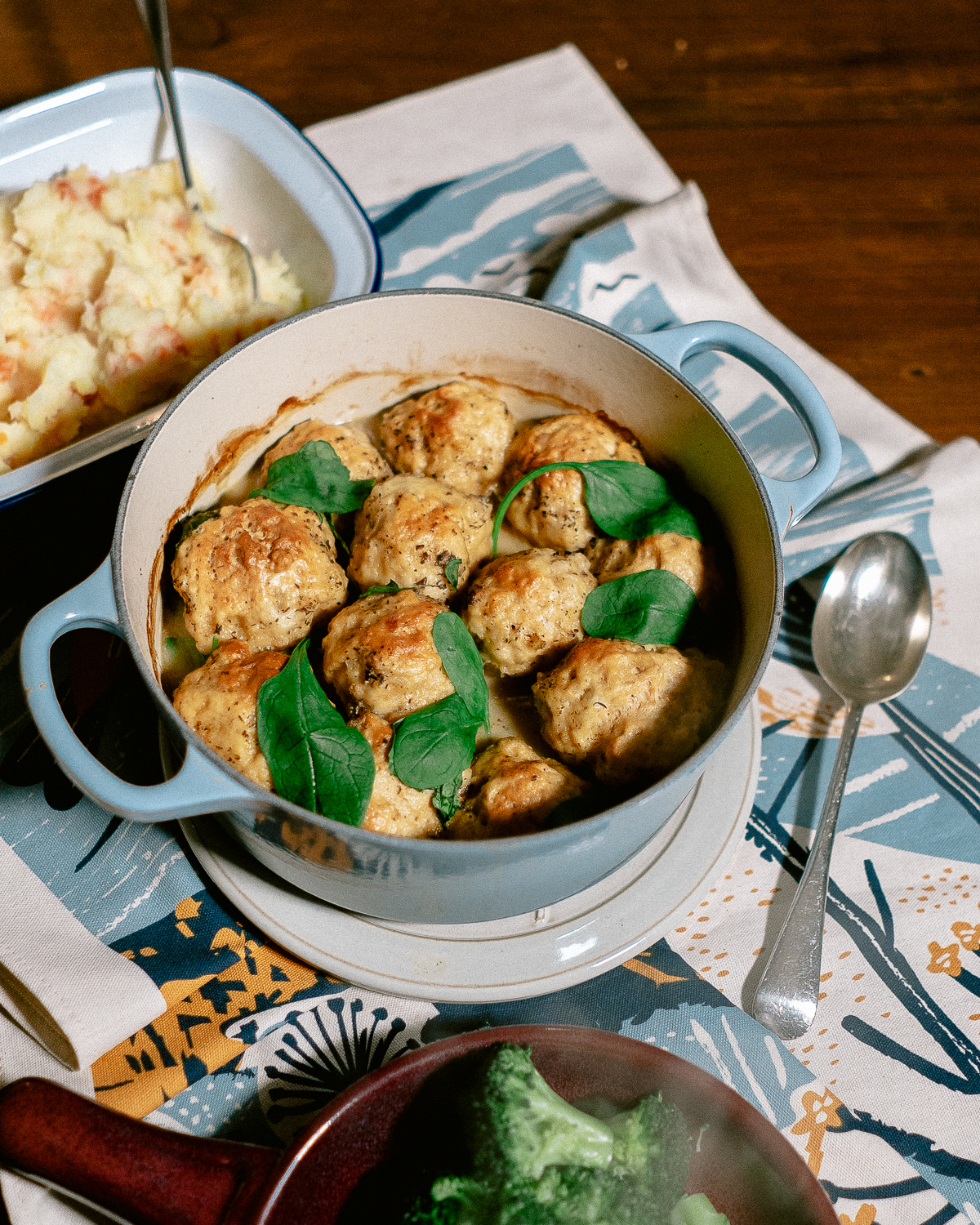Stew and dumplings in a Le Creuset casserole dish